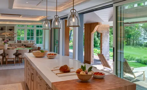 The kitchen is warm and neutral with beautiful outlook.