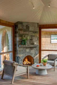Fireplace in the screened-in porch.