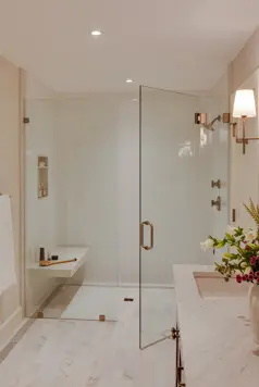 A curbless shower with a floating stone bench.