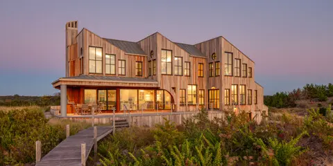 A three-part roof composition establishes the character of the entire design.