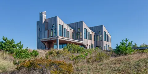 The newly designed and built home sits on the bluff.