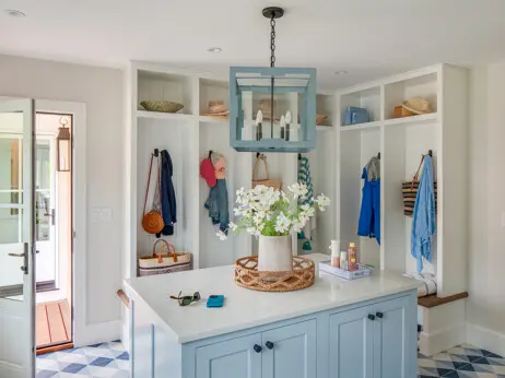 For a young, active family, the mudroom provides ample storage. The flooring adds a fun touch to the space.
